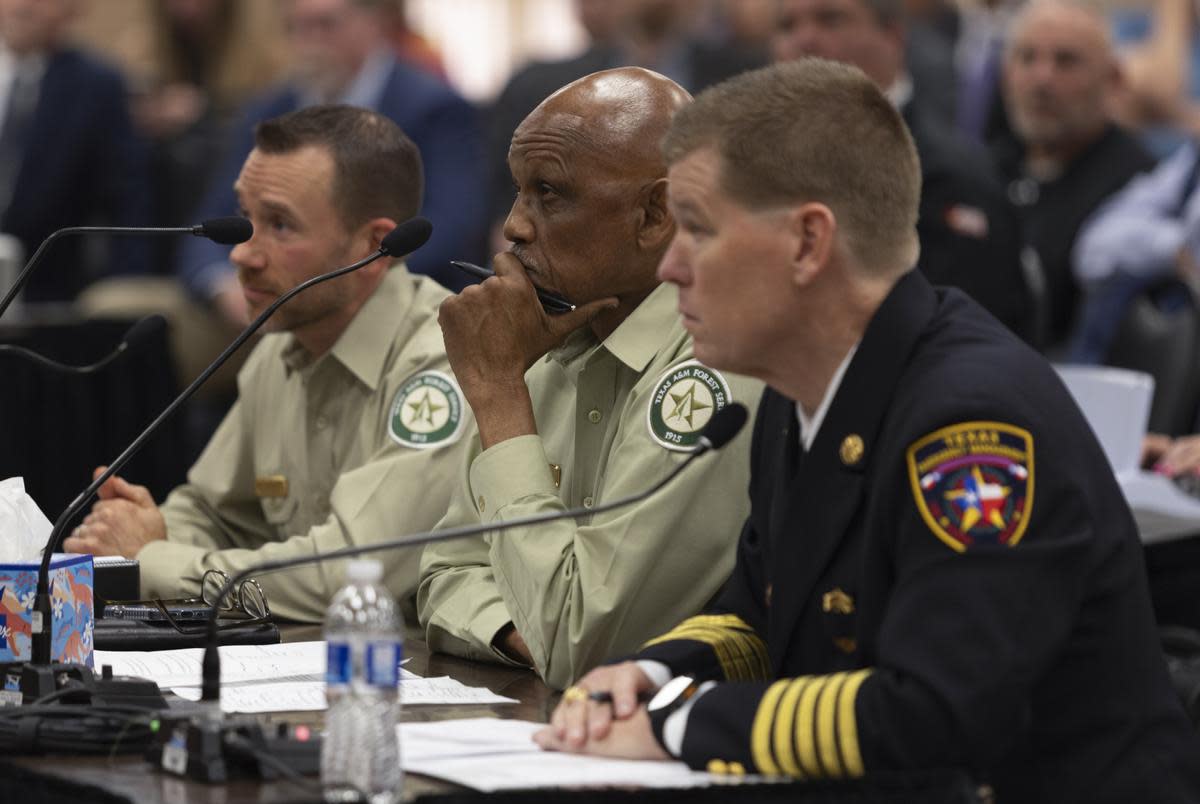 From left, Texas A&M Forest Service Fire Chief Wes Moorehead, Director of Texas A&M Forest Service, Al Davis, and Chief of the Texas Division of Emergency Management Nim Kidd, sit before a House Committee investigating the Panhandle wildfires Tuesday, April 2, 2024 in Pampa. On Tuesday, testimony focused on topics relating to the largest wildfire in Texas history.