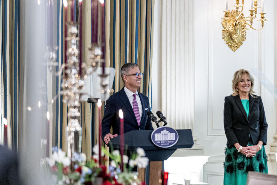 FILE - White House social secretary Carlos Elizondo, accompanied by first lady Jill Biden, speaks during a media preview for the State Dinner with President Joe Biden and French President Emmanuel Macron in the State Dining Room of the White House in Washington, Nov. 30, 2022. (AP Photo/Andrew Harnik, File)