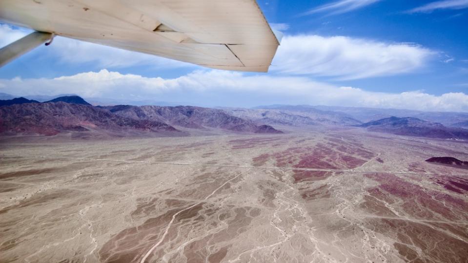 An aerial view of the Nazca Lines from an airplane.