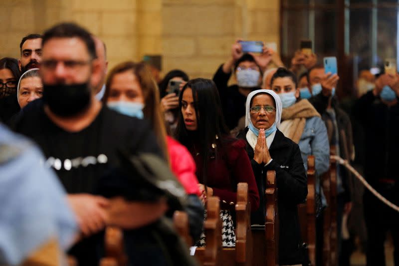 Worshippers attend Christmas morning mass as COVID-19 subdues festivities in Bethlehem