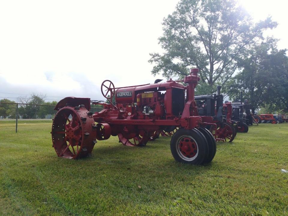 An antique tractor on display.