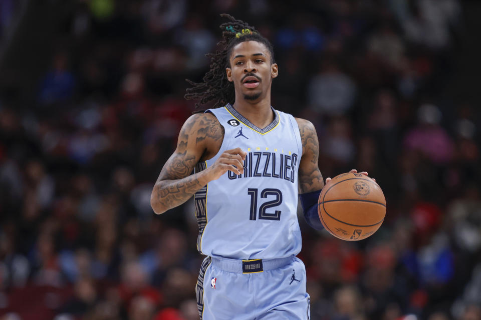 Apr 2, 2023; Chicago, Illinois, USA; Memphis Grizzlies guard Ja Morant (12) brings the ball up court against the Chicago Bulls during the first half at United Center. Mandatory Credit: Kamil Krzaczynski-USA TODAY Sports