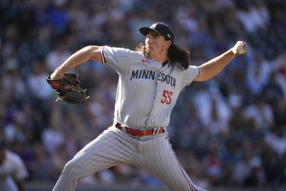 Minnesota Twins relief pitcher Kody Funderburk works against the Colorado Rockies in the 10th inning of a baseball game Sunday, Oct. 1, 2023, in Denver. (AP Photo/David Zalubowski)