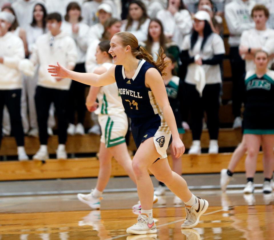 Norwell senior Makenzie Fuess celebrates making a '3' early in a semistate championship game against Bremen Saturday, Feb. 17, 2024, at Huntington North High School.