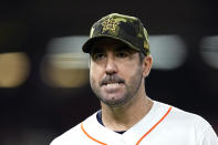 Houston Astros starting pitcher Justin Verlander walks off the field after throwing during the third inning of a baseball game against the Texas Rangers Saturday, May 21, 2022, in Houston. (AP Photo/David J. Phillip)