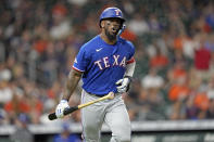 Texas Rangers' Adolis Garcia celebrates after hitting a home run against the Houston Astros during the fifth inning of a baseball game Tuesday, Aug. 9, 2022, in Houston. (AP Photo/David J. Phillip)