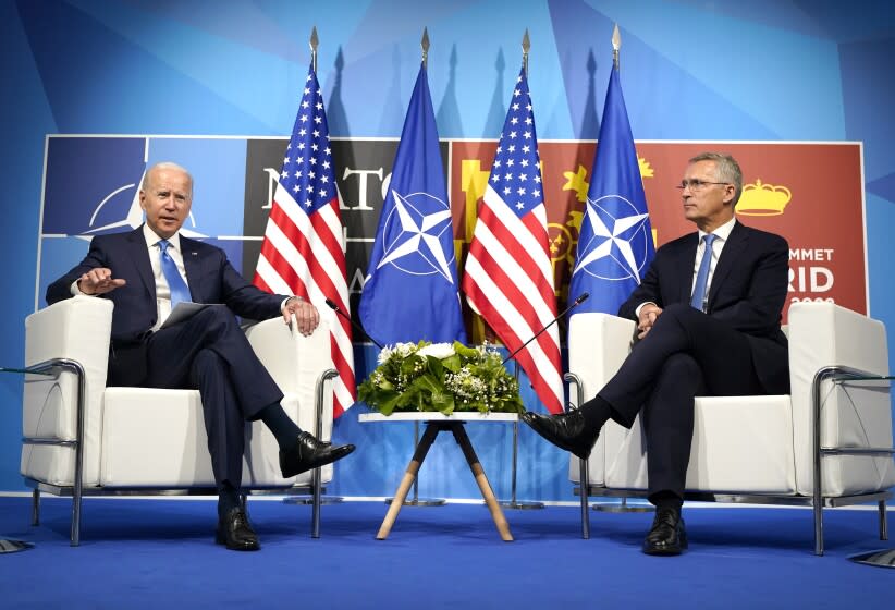 U.S. President Joe Biden, left, poses with NATO Secretary General Jens Stoltenberg during a meeting at the NATO summit in Madrid, Spain on Wednesday, June 29, 2022. North Atlantic Treaty Organization heads of state and government will meet for a NATO summit in Madrid from Tuesday through Thursday. (AP Photo/Susan Walsh)