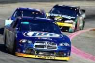 MARTINSVILLE, VA - OCTOBER 30: Brad Keselowski, driver of the #2 Miller Lite Dodge, leads Martin Truex Jr., driver of the #56 NAPA Auto Parts Toyota, and Clint Bowyer, driver of the #33 American Ethanol/ Cheerios Chevrolet, during the NASCAR Sprint Cup Series TUMS Fast Relief 500 at Martinsville Speedway on October 30, 2011 in Martinsville, Virginia. (Photo by John Harrelson/Getty Images for NASCAR)