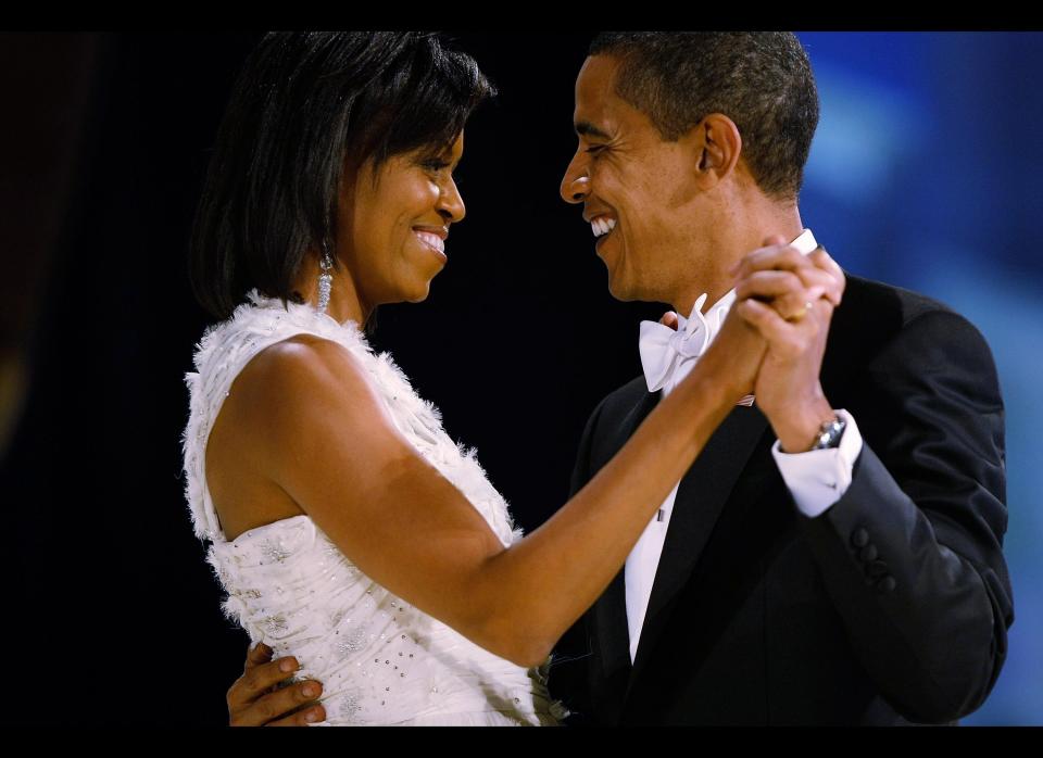 WASHINGTON - JANUARY 20:  (AFP OUT) US President Barack Obama dances with his wife and First Lady Michelle Obama during the Western Inaugural Ball on January 20, 2009 in Washington, DC. President Barack Obama was sworn in as the 44th President of the United States today, becoming the first African-American to be elected President of the US.  (Photo by Chip Somodevilla/Getty Images)