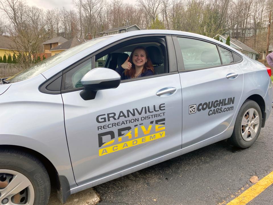 Chloe Thatcher, who previously participated in the Granville Rec District's Drive Academy, sits in the program's vehicle. The academy is now offering in-school drivers education to Granville High School students.