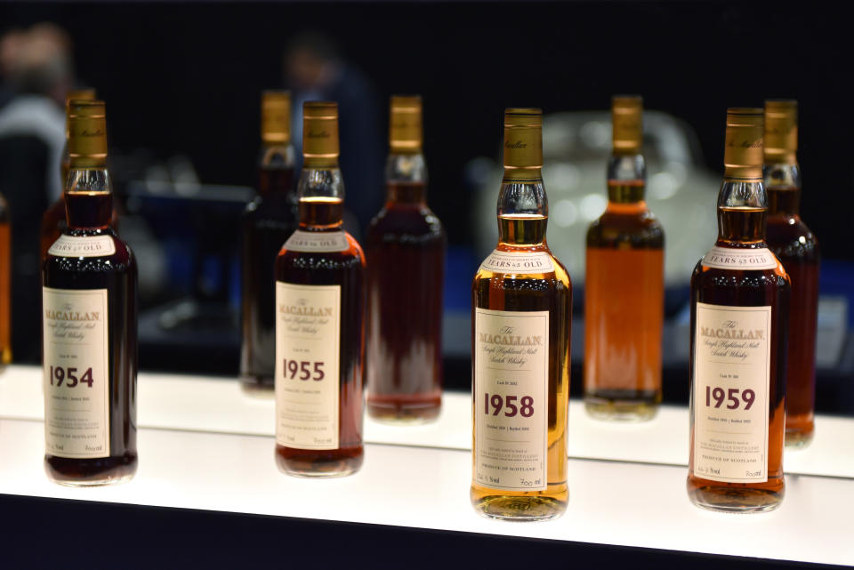 LONDON, ENGLAND - OCTOBER 23: Bottles of various years old Macallan highland single malt whisky are displayed during the RM Sotherb's London, European car collectors event at Olympia London on October 23, 2019 in London, England. RM Sotheby's London, billed as the annual highlight for European car collectors will show Edwardians to modern supercars and offers collectors and attendees the opportunity to experience the very best of European cars. Sotheby’s will also present The Ultimate Whisky Collection, the most valuable collection of whisky ever to be sold at auction, both events will culminate in live auctions on 24th October.  (Photo by John Keeble/Getty Images)