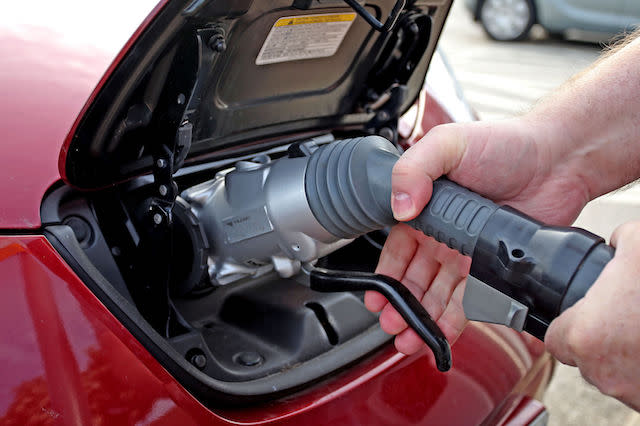 File photo dated 12/06/15 of a general view of an electric car charging point at Chester Services. New diesel and petrol cars and vans will be banned from 2040 as part of efforts to tackle air pollution, the Government is expected to announce.