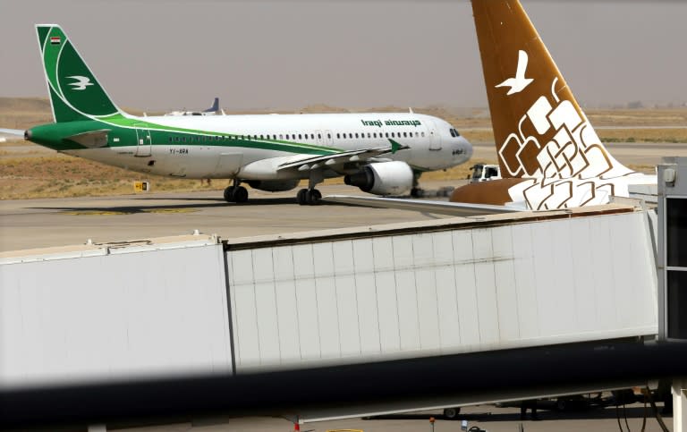 An Iraqi Airways plane sits on the tarmac at Arbil airport in Iraqi Kurdistan on September 28, ahead of a suspension of international flights out of the autonomous region over a controversial independence vote