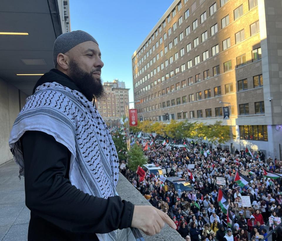 Adil Charkaoui watches over a pro-Palestinian march in Montreal.