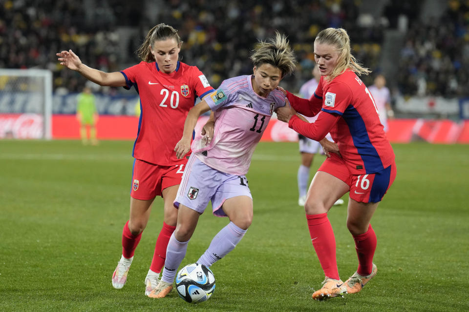 Norway's Emilie Haavi, Japan's Mina Tanaka and Norway's Mathilde Harviken, from left, challenge for the ball during the Women's World Cup second round soccer match between Japan and Norway in Wellington, New Zealand, Saturday, Aug. 5, 2023. (AP Photo/Alessandra Tarantino)