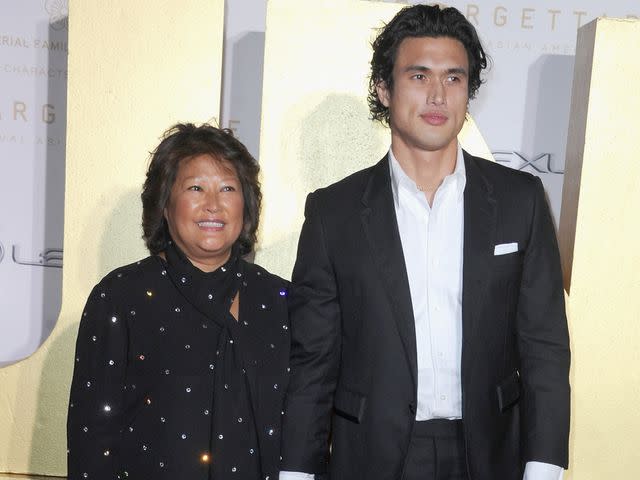<p>Albert L. Ortega/Getty</p> Charles Melton and mother Sukyong Melton attend the 19th Annual Unforgettable Gala on December 11, 2021 in Beverly Hills, California.