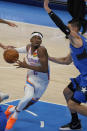 Oklahoma City Thunder guard Shai Gilgeous-Alexander (2) drives around Orlando Magic center Nikola Vucevic during the second half of an NBA basketball game Tuesday, Dec. 29, 2020, in Oklahoma City. (AP Photo/Sue Ogrocki)