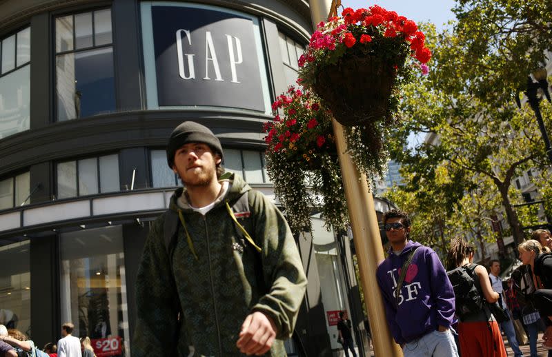 FILE PHOTO: Pedestrians walk outside Gap store in San Francisco