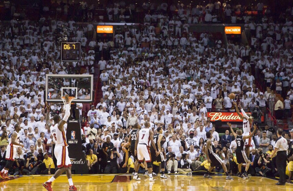 MIAMI, FL - JUNE 18: Ray Allen #34 of the Miami Heat hits a three-point shot to tie the score and send the San Antonio Spurs into overtime in Game Six of the 2013 NBA Finals on June 18, 2013 at American Airlines Arena in Miami, Florida. NOTE TO USER: User expressly acknowledges and agrees that, by downloading and or using this photograph, User is consenting to the terms and conditions of the Getty Images License Agreement. Mandatory Copyright Notice: Copyright 2013 NBAE (Photo by Nathaniel S. Butler/NBAE via Getty Images)