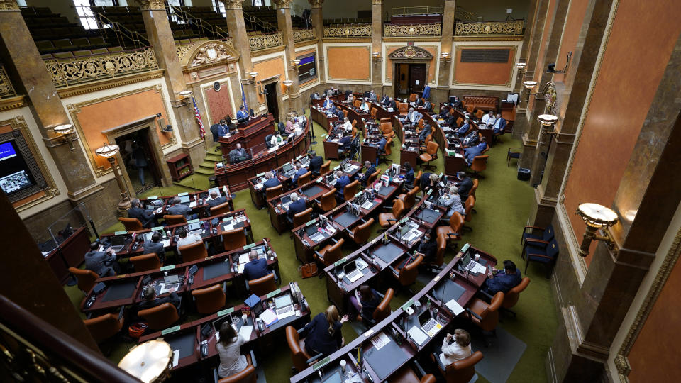 FILE - In this Aug. 20, 2020 file photo the Utah House of Representatives convenes for a special session of the Legislature at the Utah State Capitol in Salt Lake City. Legislative efforts to restrict access to booking photos are growing as major police departments are imposing policies against releasing them and news organizations reconsider their approach to covering criminal justice. Delaware. (AP Photo/Rick Bowmer,File)