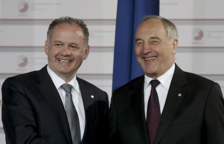 Latvian President Andris Berzins welcomes Slovakia's President Andrej Kiska (L) at the Eastern Partnership Summit in Riga, Latvia, May 21, 2015. REUTERS/Ints Kalnins