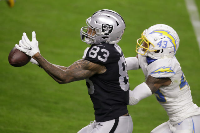 FILE - Las Vegas Raiders tight end Darren Waller looks on before