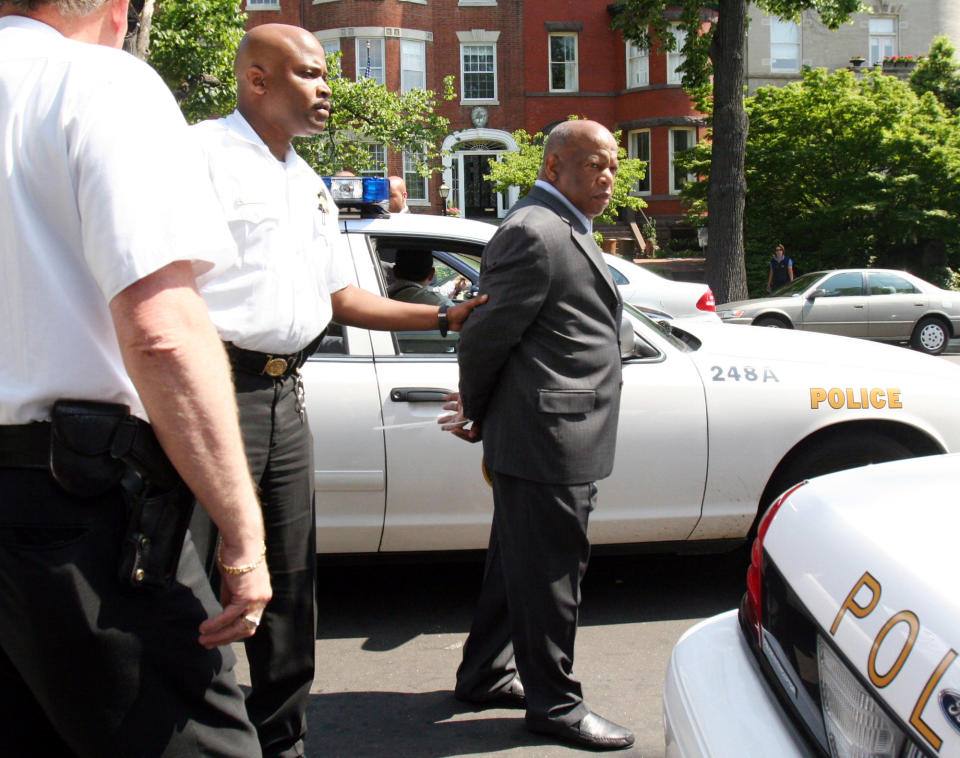 Congressional Black Caucus members, including Rep. John Lewis, D-Ga., right, were arrested after a news conference regarding Darfur on May 16, 2006, at the Sudanese Embassy in Washington. They were arrested by Secret Service Uniform Division officers for blocking the entrance of the embassy. (Photo: Lauren Victoria Burke/AP)