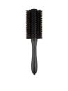 <p>Use the Oribe medium boar bristle round brush in tandem with a <a rel="nofollow noopener" href="https://www.dermstore.com/product_Pro+Dryer+2000_50279.htm" target="_blank" data-ylk="slk:blowdryer;elm:context_link;itc:0;sec:content-canvas" class="link ">blowdryer</a> on the high speed/hot setting to best achieve retro volume. For each section, anchor the bristles at the tip of the hair and roll back until they meet the root. Then, follow with a blow dryer while pulling the brush away from the head as the hair is slowly released. Upturn the brush at the ends to create a flipped-out look.</p>