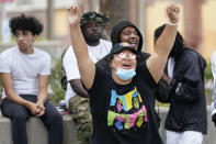 People dance in Jefferson square, Friday, Sept. 25, 2020, in Louisville. Breonna Taylor's family demanded Friday that Kentucky authorities release all body camera footage, police files and the transcripts of the grand jury hearings that led to no charges against police officers who killed the Black woman during a March drug raid at her apartment. (AP Photo/Darron Cummings)