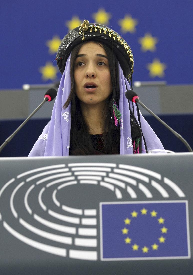 Yazidi woman from Iraq, Nadia Murad Basee, addresses members of the European parliament after receiving the European Union's Sakharov Prize for human rights in Strasbourg, eastern France, Tuesday Dec. 13, 2016. Two Yazidi women who escaped sexual enslavement by the Islamic State group and went on to become advocates for others have won the European Union's Sakharov Prize for human rights. The award, named after Soviet dissident Andrei Sakharov, was created in 1988 to honor individuals or groups who defend human rights and fundamental freedoms. (AP Photo/Christian Lutz)