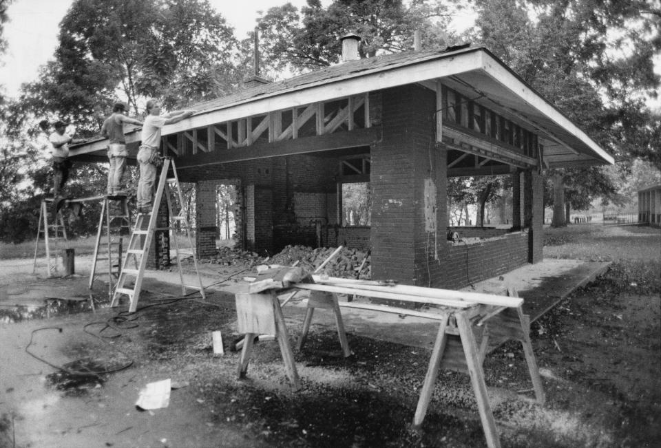 Photo by John L. Goff, Sept. 29, 1988. George Walden, left, Jerry Murray, center, and Jim Hardesty recently installed a roof on the new pavilion in Chickasaw Park. 