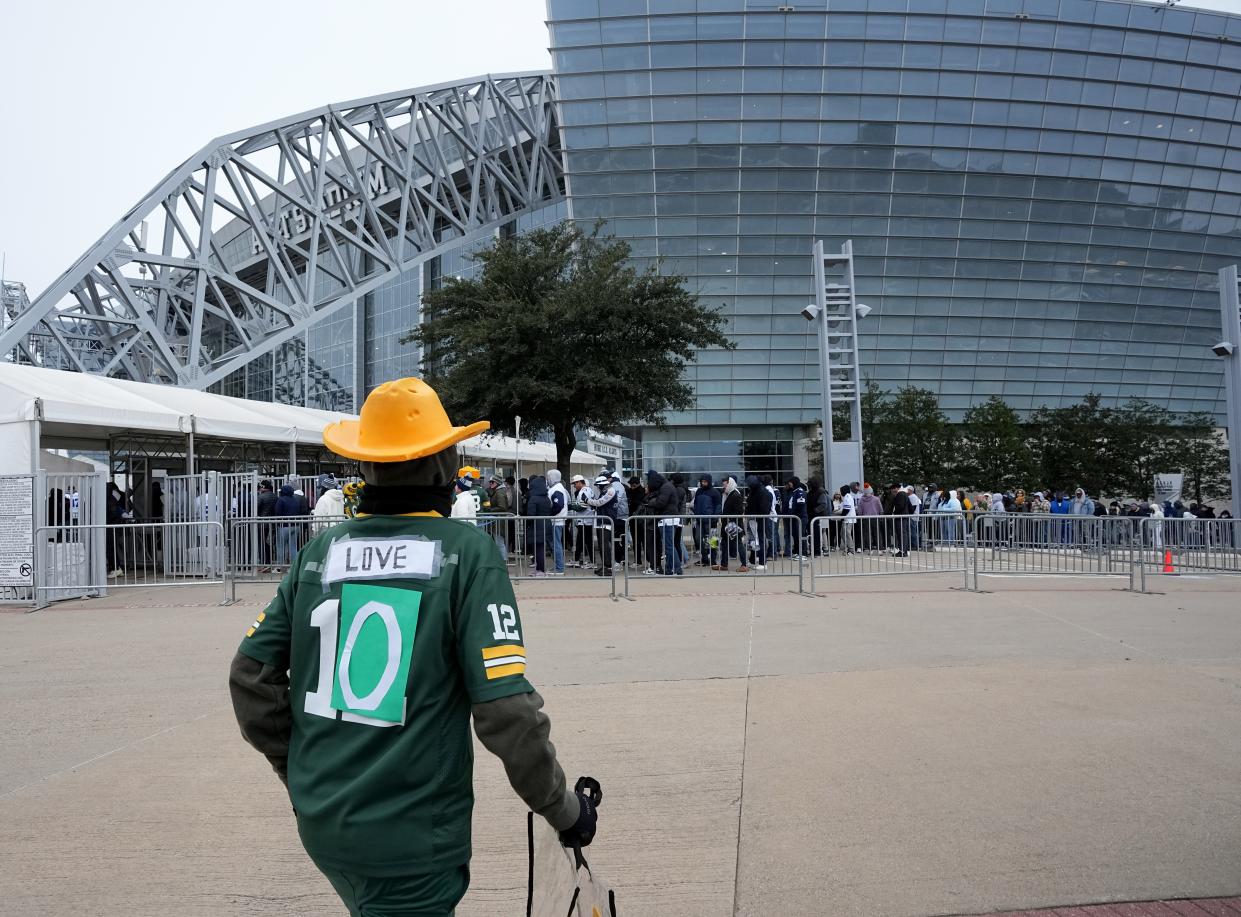 A fan walks into AT&T Stadium in Arlington, Texas on Sunday, January 14, 2024 prior to the playoff game between the Green Bay Packers and Dallas Cowboys.