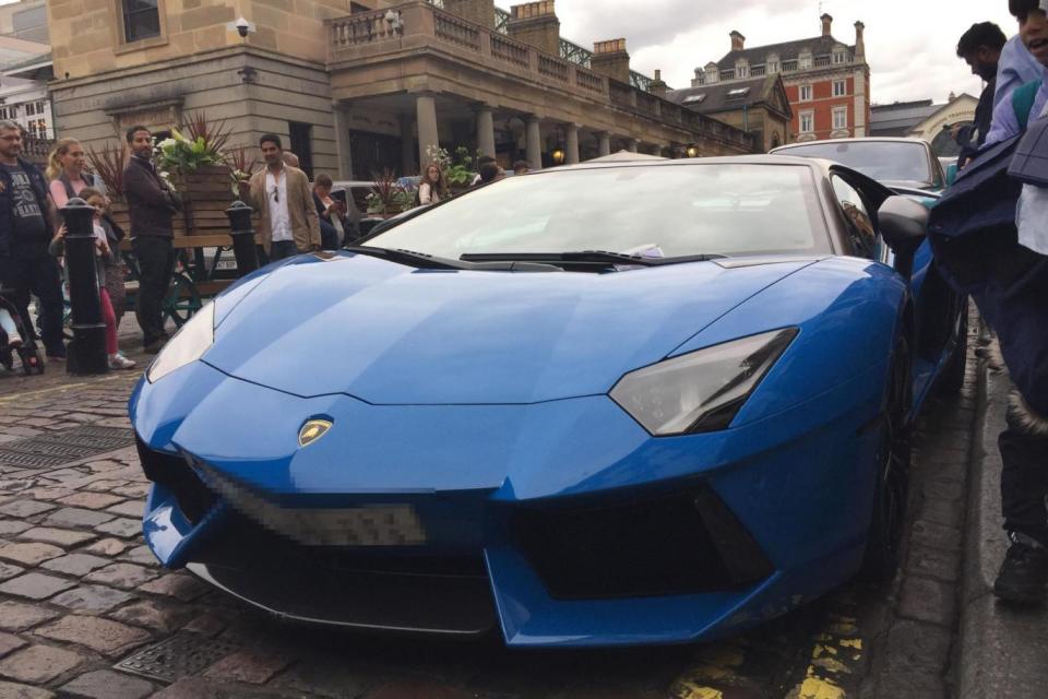 Bystanders marvel at the Lamborghini Aventador, which sells for £270,000 and upwards.