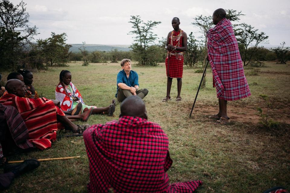 Nikolaj Coster-Waldau meets with elders at the Nashulai Maasai Conservancy in Kenya.