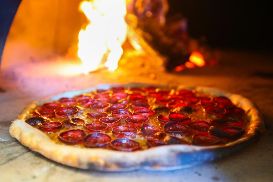 Hop Atomica's pepperoni pizza cups when cooked. The pepperoni that executive chef Bryce Montesa uses has a natural casing, which helps the pepperoni cup when cooked. The edges of the meat become crisp and crunchy, and it also holds the natural juices as well. Feb. 20, 2024