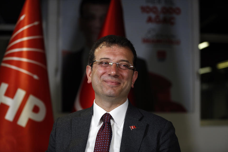 Ekrem Imamoglu, the opposition, Republican People's Party's (CHP) mayoral candidate in Istanbul, smiles during an interview with The Associated Press in Istanbul, Thursday, April 4, 2019. Imamoglu said he's confident that the result of a recount of votes in the city will confirm his victory and has renewed an appeal to Turkey's President Recep Tayyip Erdogan to help end the standoff. Imamoglu won the tight race for Istanbul in Sunday's local elections in a major upset for Erdogan, who rose to power as the mayor of the city of 15 million and has said that whoever wins Istanbul wins to whole of Turkey. (AP Photo/Lefteris Pitarakis)