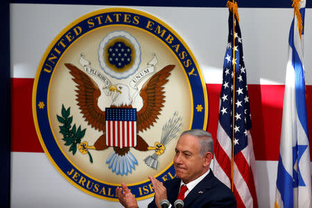 FILE PHOTO: Israeli Prime Minister Benjamin Netanyahu claps his hands during the dedication ceremony of the new U.S. embassy in Jerusalem, Israel May 14, 2018. REUTERS/Ronen Zvulun/File Photo