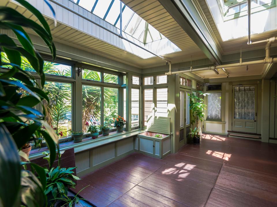 the north conservatory at the winchester house with lots of windows and plants