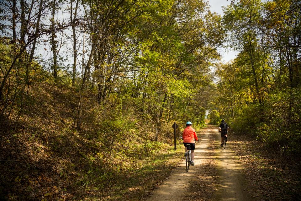 Cyclists ride on the Great River State Trail in western Wisconsin.