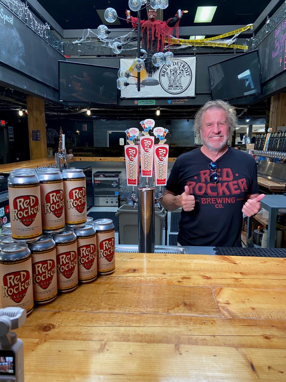 Sammy Hagar poses with cans of his Red Rocker Lager at Brew Detroit in Corktown on Tuesday, Oct. 24, 2023.