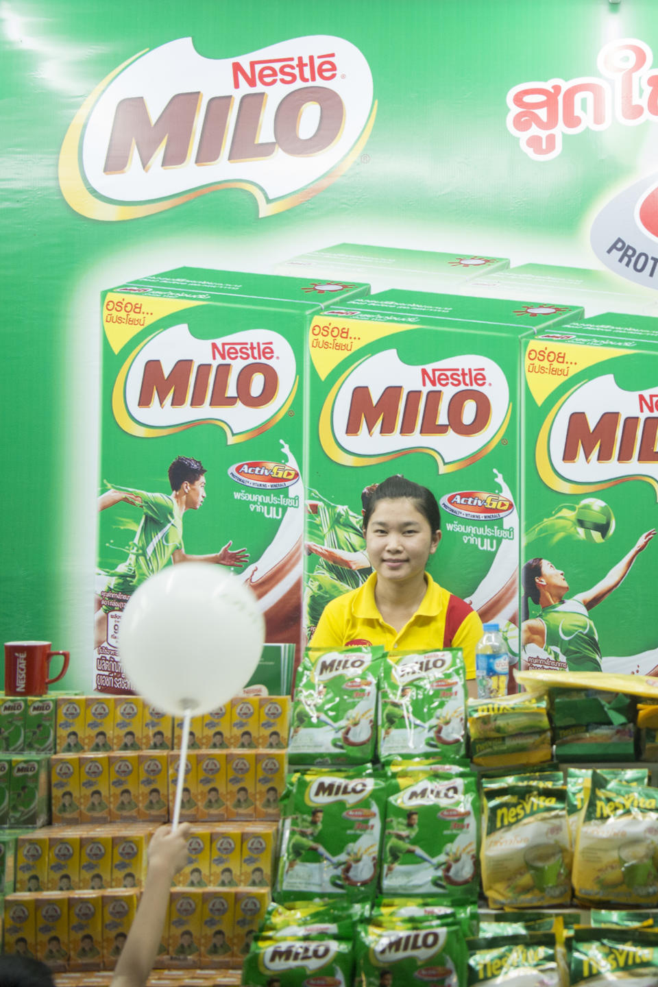 a nestle and milo shop at the market at the Pha That Luang Festival in the city of vientiane in Laos in the southeastasia.