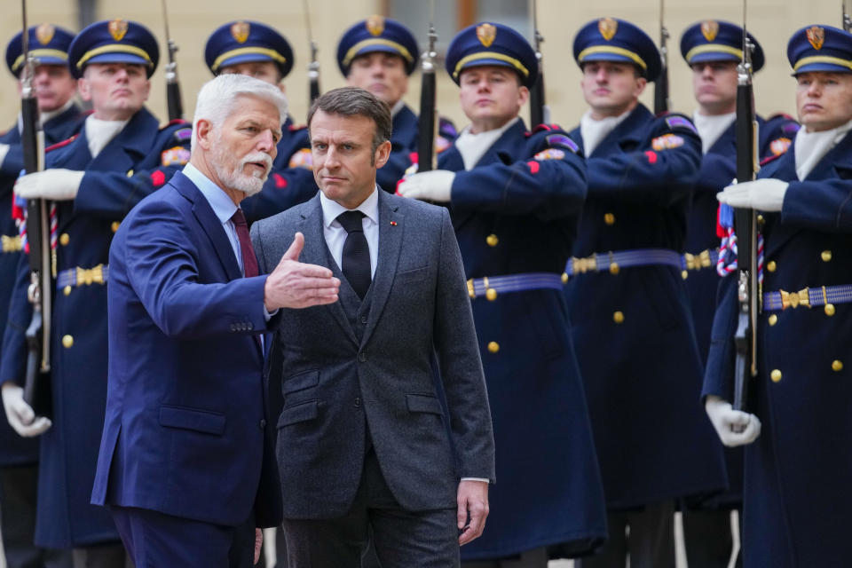 Czech Republic's President Petr Pavel, left, welcomes his French counterpart Emmanuel Macron at the Prague Castle in Prague, Czech Republic, Tuesday, March 5, 2024. Macron is on a one-day official visit to Czech Republic. (AP Photo/Petr David Josek)