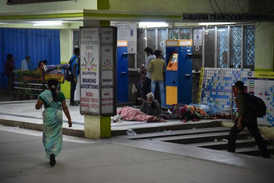 The bustle of the railway station continues around the sleepers (Narayana Swamy Subbaraman)