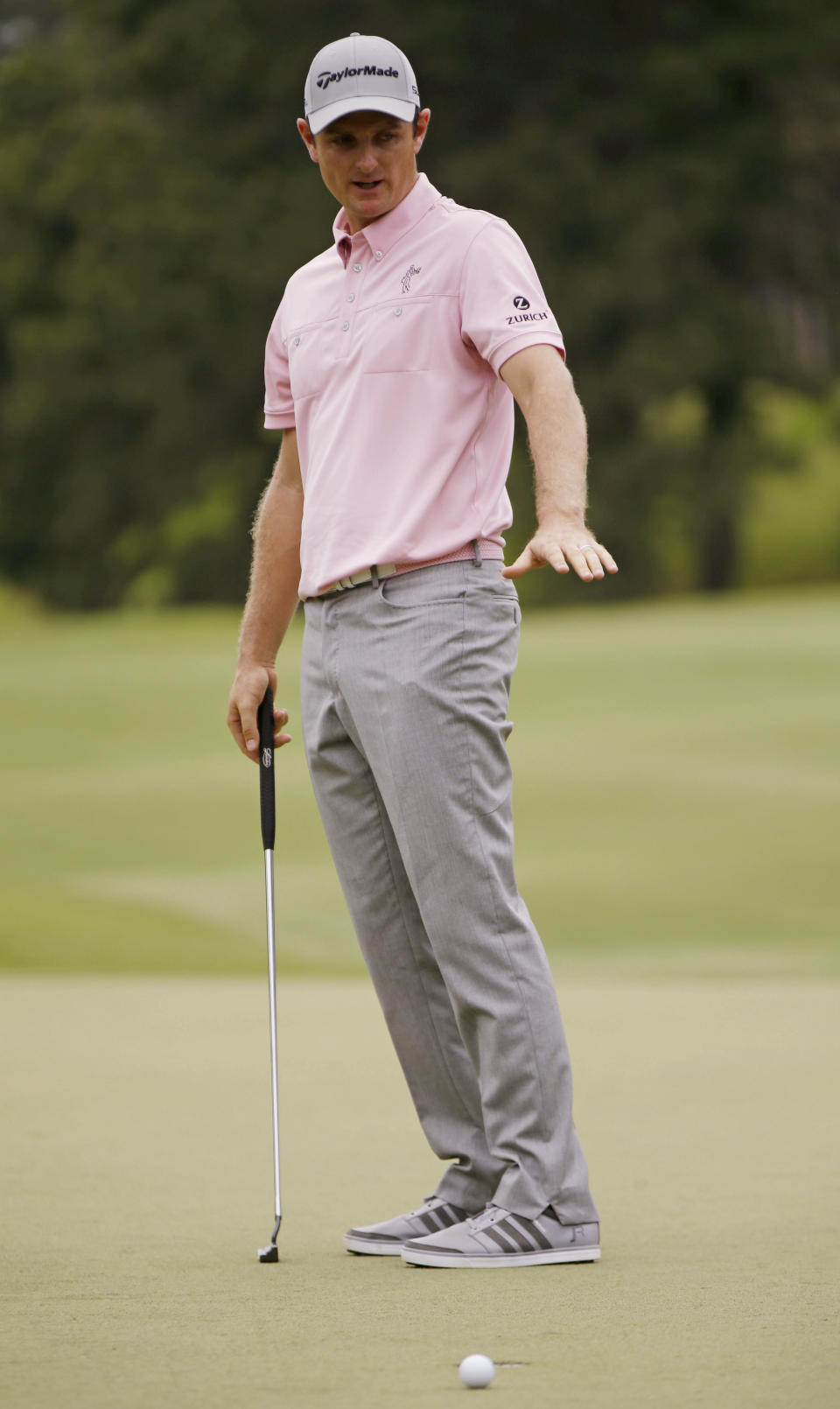 Justin Rose of England, gestures after his ball misses the 7th hole cup during the final round of The Players championship golf tournament at TPC Sawgrass, Sunday, May 11, 2014 in Ponte Vedra Beach, Fla. (AP Photo/Gerald Herbert)