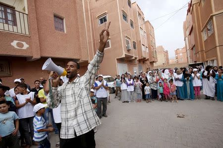 A supporter of the islamist Justice and Development Party (PJD) shouts slogans during a campaign rally ahead of the communal and regional elections, in the city of Tinghir, in southeastern Morocco, August 31, 2015. REUTERS/Youssef Boudlal