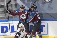 Colorado Avalanche' Nathan MacKinnon (29) and Mikko Rantanen (96) celebrate a goal as Arizona Coyotes' Jason Demers (55) skates past during the first period of a first round NHL Stanley Cup playoff hockey series in Edmonton, Alberta, Friday, Aug. 14, 2020. (Jason Franson/The Canadian Press via AP)