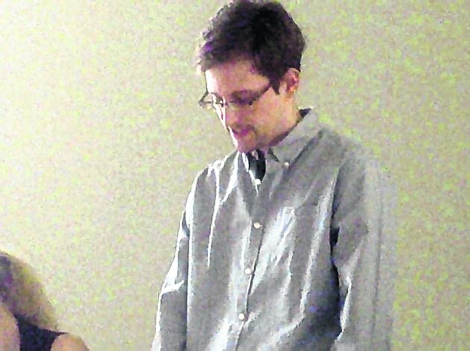 This handout file photo taken July 12 and made available Wednesday by Human Rights Watch shows NSA leaker Edward Snowden during his meeting with Russian activists and officials at Sheremetyevo airport in Moscow.