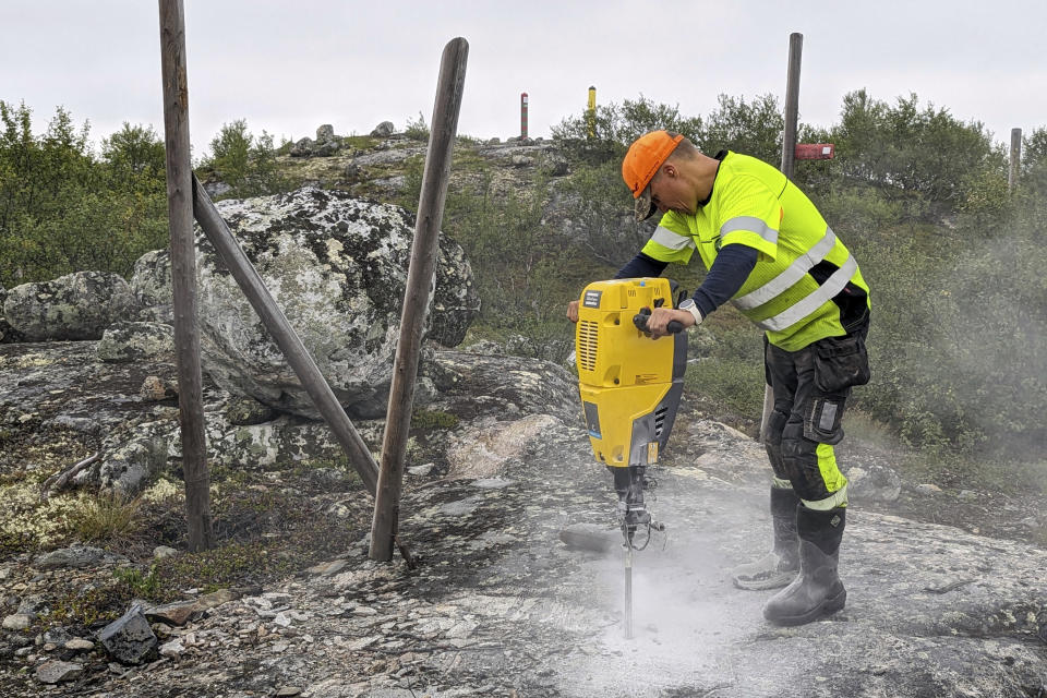 A man works to build a new fence along the border with Russia, next to Storskog, Norway, Wednesday Aug. 23, 2023. Norway is re-building a section of fence in the Arctic along its border with Russia to contain wandering reindeer, Norwegian officials said Thursday, adding 42 animals have crossed into its eastern neighbor in a costly stroll this year. (HT Gjerde Finnmark via AP)