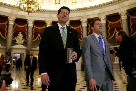 U.S. House Speaker Paul Ryan (R-WI) (C) walks to the House floor for the opening of a morning session as Congress considers health care legislation to repeal Obamacare at the U.S. Capitol in Washington, U.S., March 24, 2017. REUTERS/Jonathan Ernst