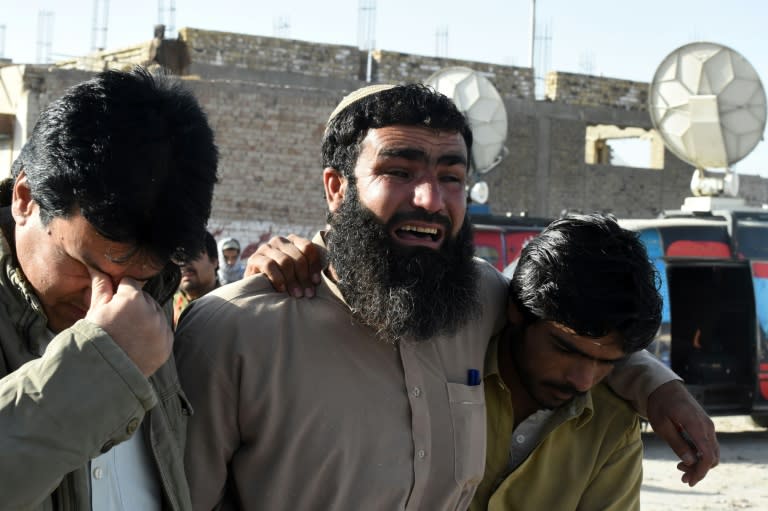 Pakistani relatives mourn the loss of family members in Quetta on October 25, 2016 after an attack on the Balochistan Police College